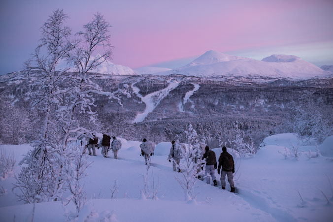 Norwegian and US soldiers walking together during Exercise White Ulfbehrt in 2019 near Setermoen in northern Norway.