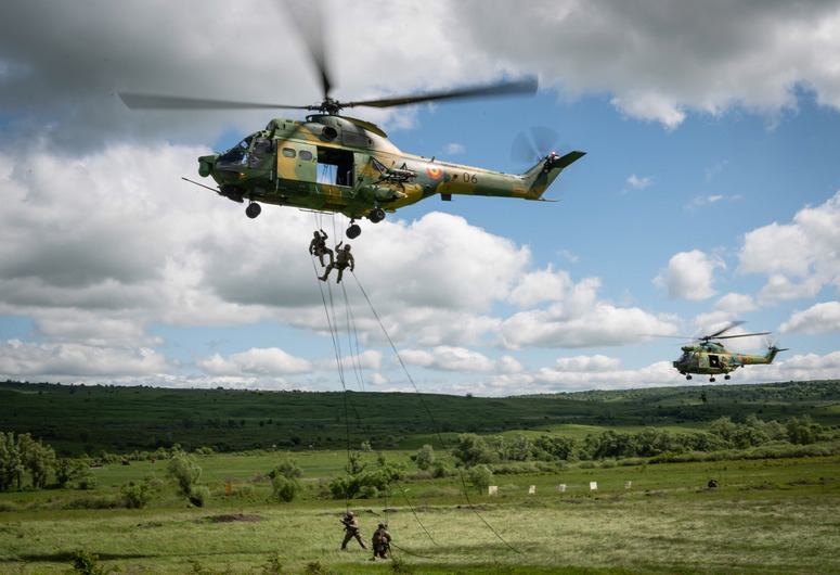 CINCU, Romania – Romanian IAR 330 helicopters transport special forces troops during Exercise Steadfast Defender 2021.

Steadfast Defender 2021 is a NATO-led exercise involving over 9,000 troops from more than 20 NATO Allies and partners. The objective is to ensure that NATO forces are trained, able to operate together and ready to respond to any threat from any direction. More information on Steadfast Defender 2021 can be found here and here. 
 
NATO is taking the necessary measures to protect our armed forces. This includes COVID-19 precautions, such as pre-deployment testing and quarantining.