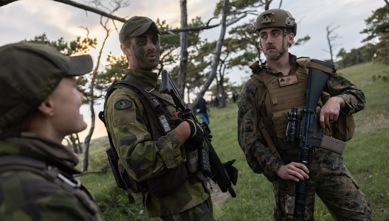 A US Marine rifleman chats with members of the Swedish Home Guard stationed on the island of Gotland on 7 June during Exercise BALTOPS 22. An annual naval exercise that takes place in the Baltic Sea, this year's iteration was hosted by Sweden, which applied for NATO membership in May.