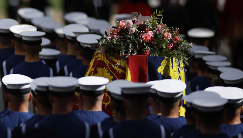 The coffin of Britain's Queen Elizabeth seen on the procession following the funeral service on the day of the state funeral and burial of Britain's Queen Elizabeth, in London, Britain, September 19, 2022 REUTERS/John Sibley