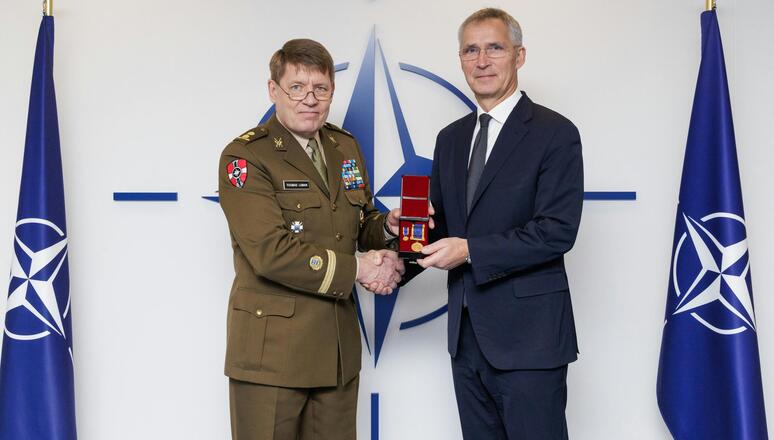 NATO Secretary General Jens Stoltenberg receives a medal from the Interallied Confederation of Reserve Officers (CIOR)