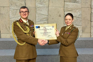 Lieutenant Colonel Melissa Gray of the United Kingdom Defence Medical Services receiving the Dominique-Jean Larrey Award