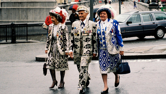 A group of ‘Pearly Kings and Queens’ – East London residents who sew thousands of buttons into their clothes and raise money for charities – arrives to watch the proceedings at the 1990 London Summit, a landmark summit that helped set NATO’s direction after the Cold War.