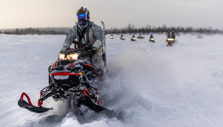 US Army Special Forces soldiers drive snowmobiles through the deep snow of the Swedish Arctic ahead of exercise Cold Response 22, a Norwegian-led multinational exercise that helped NATO Allies and partners train for military operations in the High North.