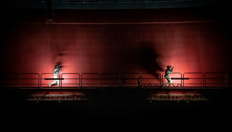 Operators from the United Kingdom Special Forces sprint along a cat walk following an assault on an oil rig during exercise Night Hawk 21 on October 6 2021. Nighthawk 21 brought together Special Operations Forces from 13 NATO Allies and partners to test their ability to work together through a series of complex counter-terrorism and hybrid warfare scenarios.