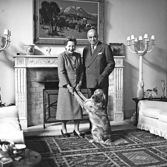 Lord Ismay, NATO's first Secretary General, and his wife, Lady Ismay, 'paws' for a photo with their beloved golden retriever at their official residence, Villa Said, in Paris (1955). 