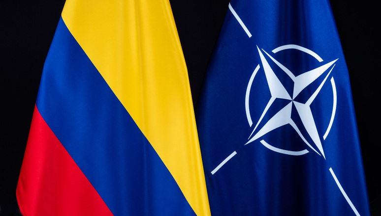 Colombia and NATO flags on black