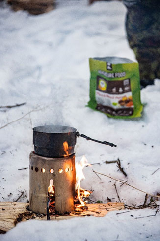 Estonian military ration being prepared over a fire.