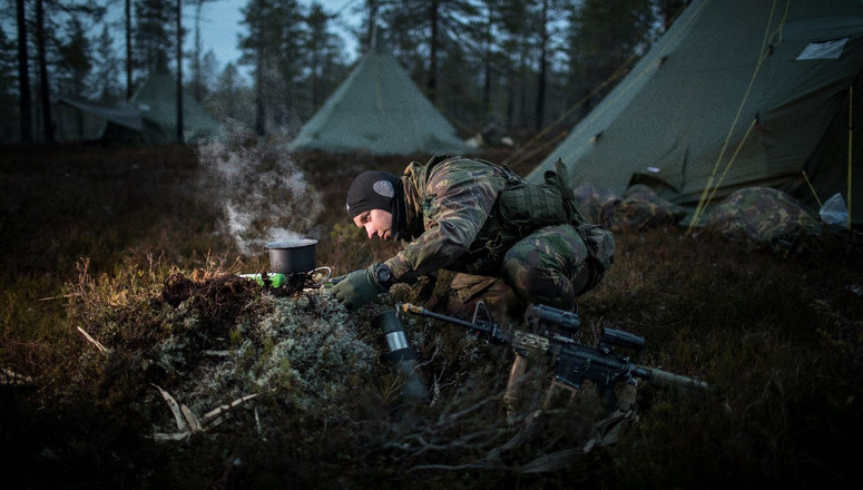 A soldier from the Dutch 43 Mechanized Brigade sets up camp during exercise Trident Juncture 2018.