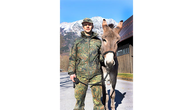 Master Sergeant Matthias Havel with their new team member – Purzel, the donkey 