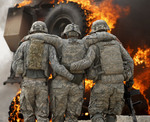 110419-wounds-of-war.jpg - US Army soldiers assist comrade after IED on a road near Combat Outpost Nolen, 80.30KB