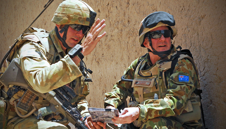 Photo By: Corporal (CPL) Ricky Fuller Caption: Operational Mentoring and Liaison Team Leader, Lieutenant Jacob Kleinman discusses the patrol route with Brigadier John Caligari, during a brief halt in a joint Australian and Afghan patrol in Afghanistan. Mid Caption: Deputy Commander joins his troops on the ground in southern Afghanistan. There is an old military adage that time spent in reconnaissance is time not wasted and during his recent visit to the 1st Mentoring and Reconstruction Task Force (MRTF â 1), Deputy Commander of Australian Forces in Afghanistan, Brigadier John Caligari, took the opportunity to gain a first hand experience of the world in which his soldiers operate. Having joined the Battle Group on a mission âoutside the wireâ to participate in the opening of the Australian built Sorkh Morgab Basic Health Centre, the Brigadier joined MRTF â 1 Commanding Officer, Lieutenant Colonel Shane Gabriel and the soldiers from one of his Operational Mentoring and Liaison Teams on a foot patrol of the surrounding region. The area has seen serious engagements with the Taliban during the eight month deployment of the 1st Mentoring and Reconstruction Task Force. The Brigadier experienced first hand the complex urban and rural environments in which his soldiers have had to operate and the oppressive heat of the Afghan summer. Brigadier Caligari also got to meet the local people who are benefiting from both Australian lines of operation, the mentoring of Afghan soldiers and the reconstruction of much needed infrastructure in the rural province.